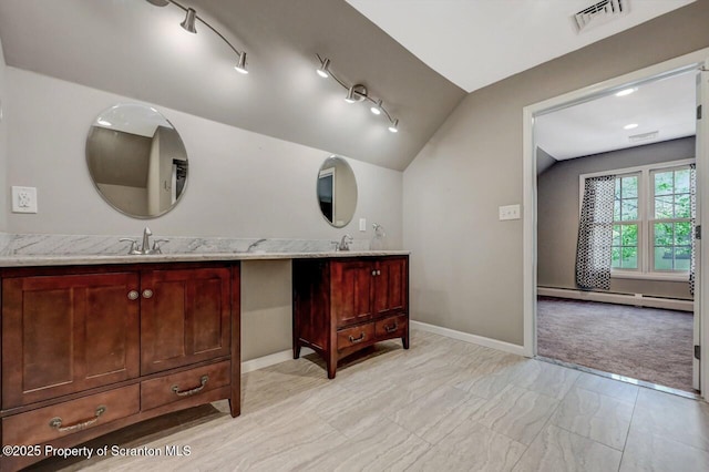 27 Emerson Dr, Moosic, PA 18507 - bathroom featuring lofted ceiling, vanity, marble look tiles, baseboard heating, and baseboards