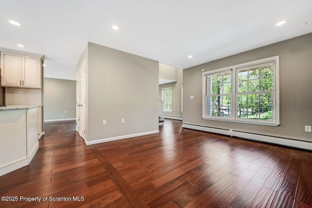 27 Emerson Dr, Moosic, PA 18507 - unfurnished living room with wood-type flooring, baseboard heating, recessed lighting, and baseboards