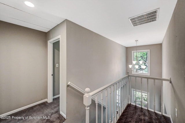 27 Emerson Dr, Moosic, PA 18507 - staircase with carpet floors, a chandelier, and baseboards