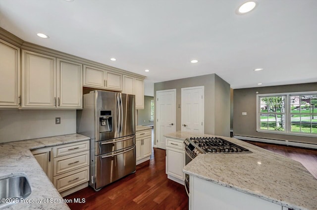27 Emerson Dr, Moosic, PA 18507 - kitchen featuring stainless steel appliances, dark wood-type flooring, a kitchen island, light stone counters, and cream cabinetry