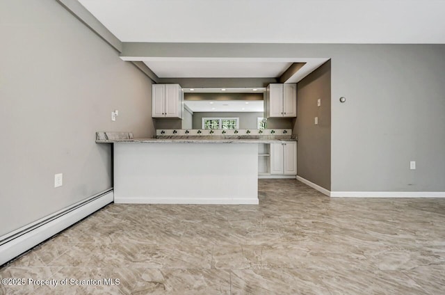 27 Emerson Dr, Moosic, PA 18507 - kitchen with a baseboard radiator, white cabinets, baseboards, recessed lighting, and a peninsula
