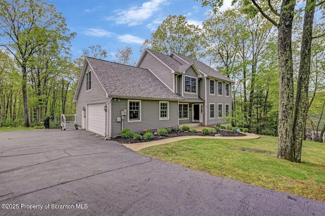27 Emerson Dr, Moosic, PA 18507 - colonial house featuring driveway, a front yard, and roof with shingles
