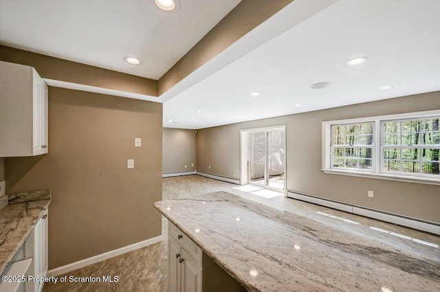 27 Emerson Dr, Moosic, PA 18507 - kitchen featuring baseboard heating, light stone counters, baseboards, white cabinetry, and recessed lighting