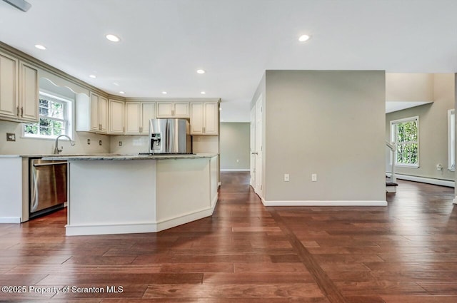 27 Emerson Dr, Moosic, PA 18507 - kitchen featuring stainless steel appliances, cream cabinets, dark wood-style flooring, plenty of natural light, and recessed lighting