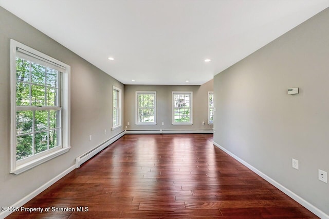 27 Emerson Dr, Moosic, PA 18507 - unfurnished living room with baseboards, wood finished floors, a baseboard heating unit, recessed lighting, and baseboard heating