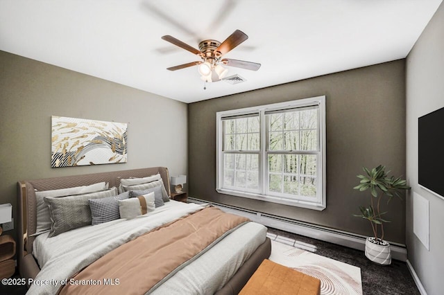 27 Emerson Dr, Moosic, PA 18507 - carpeted bedroom featuring a baseboard heating unit, a ceiling fan, and baseboards