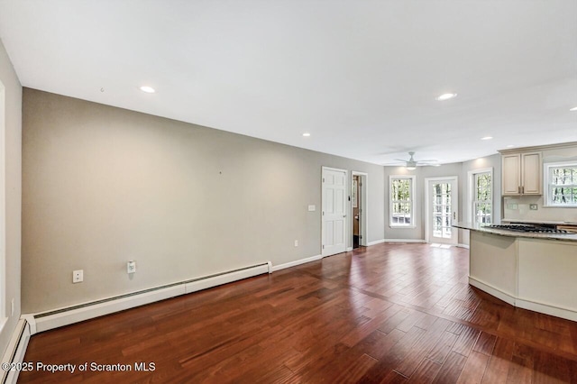 27 Emerson Dr, Moosic, PA 18507 - kitchen with a baseboard radiator, wood finished floors, open floor plan, a ceiling fan, and cream cabinetry