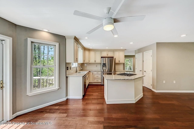 27 Emerson Dr, Moosic, PA 18507 - kitchen with stainless steel appliances, a sink, cream cabinetry, dark wood finished floors, and a kitchen island