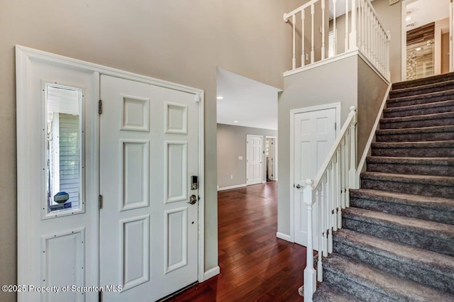 27 Emerson Dr, Moosic, PA 18507 - foyer entrance with dark wood-style flooring, stairs, a high ceiling, and baseboards