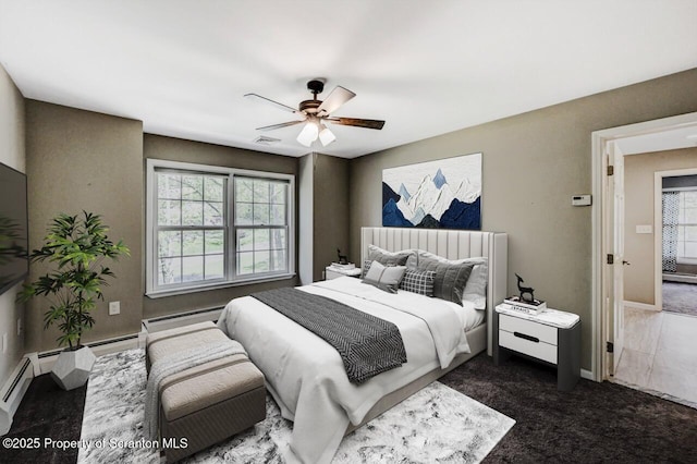 27 Emerson Dr, Moosic, PA 18507 - bedroom featuring dark colored carpet, a ceiling fan, baseboards, and baseboard heating