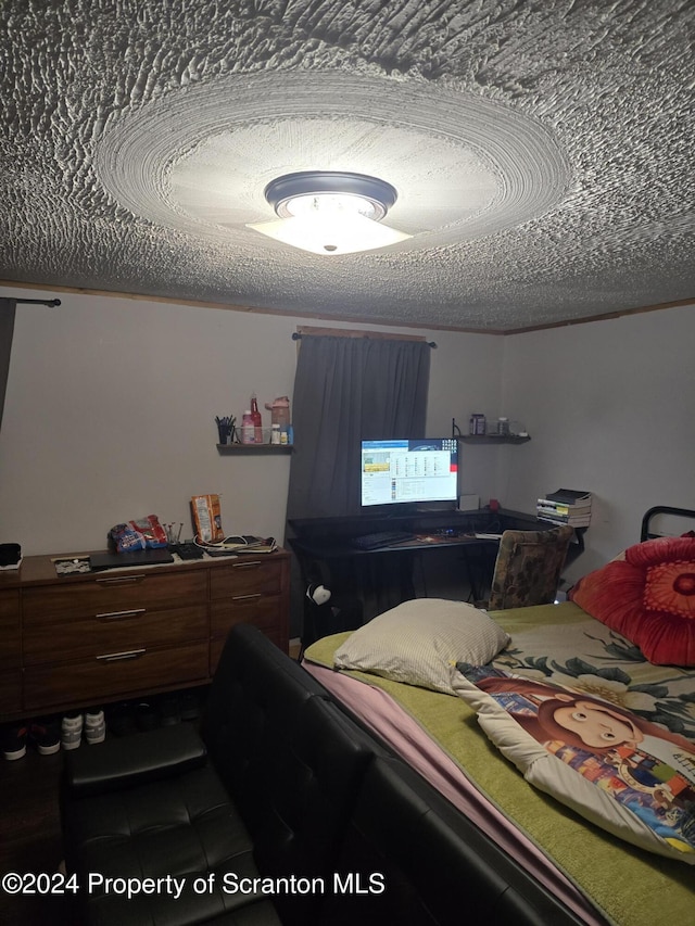 bedroom featuring a textured ceiling