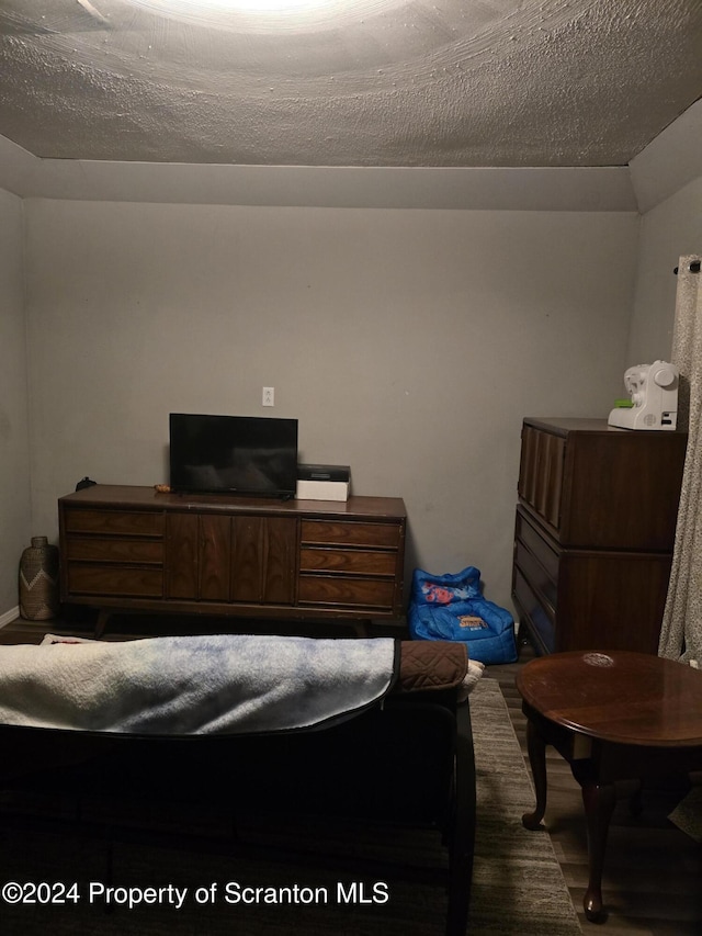 bedroom featuring a textured ceiling