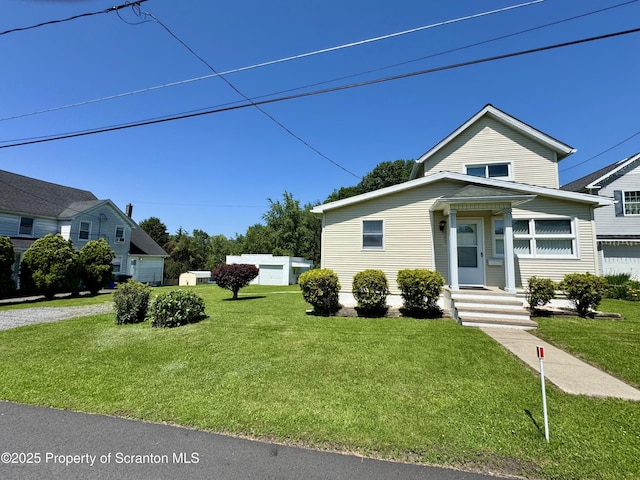 633 Thomas St, Eynon, PA 18403 - view of front of house with a front lawn