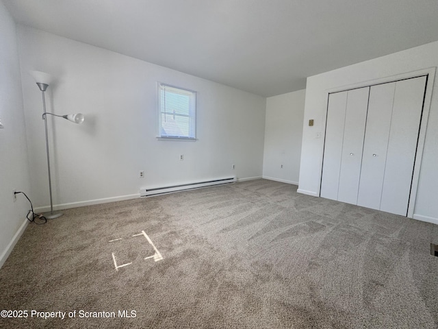 633 Thomas St, Eynon, PA 18403 - unfurnished bedroom featuring a baseboard radiator, carpet, and a closet