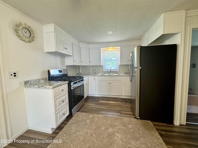 633 Thomas St, Eynon, PA 18403 - kitchen featuring stainless steel appliances, dark wood-type flooring, white cabinetry, and light stone countertops