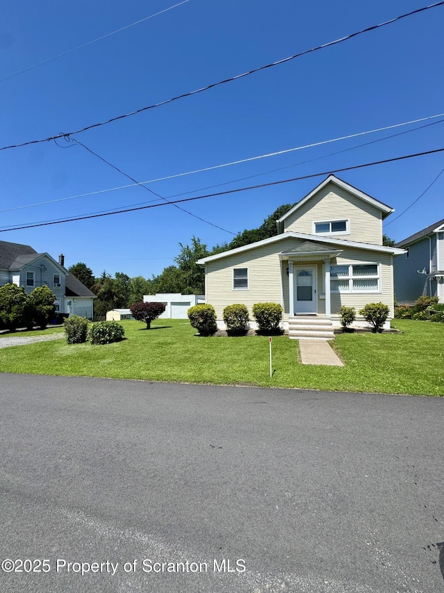 633 Thomas St, Eynon, PA 18403 - traditional-style home with a front lawn