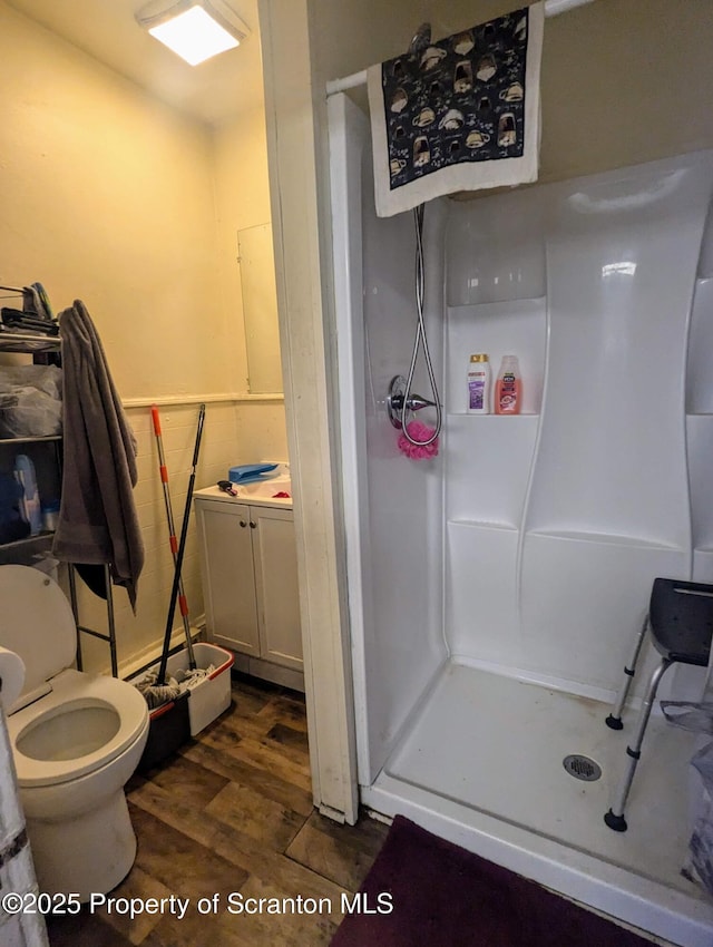 1310 Washburn St, Scranton, PA 18504 - bathroom with a shower stall, wood finished floors, and toilet