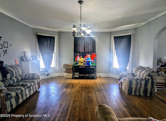 1310 Washburn St, Scranton, PA 18504 - living area with arched walkways, hardwood / wood-style floors, a chandelier, baseboards, and crown molding