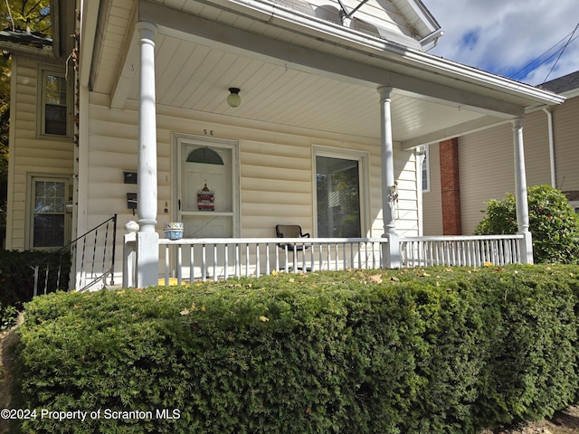 property entrance with covered porch