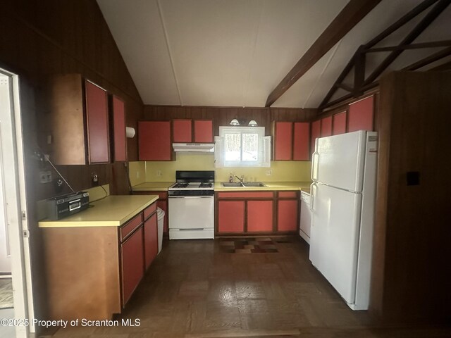 105 Hughes Dr, Greene Twp, PA 18426 - kitchen featuring white appliances, under cabinet range hood, red cabinets, dark flooring, and light countertops