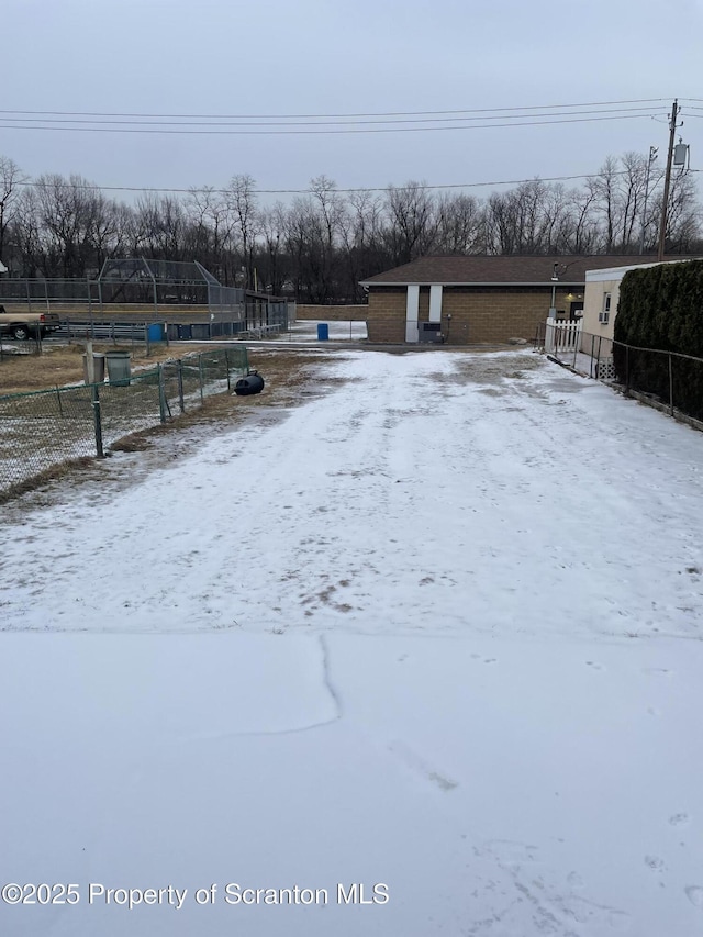 view of yard layered in snow