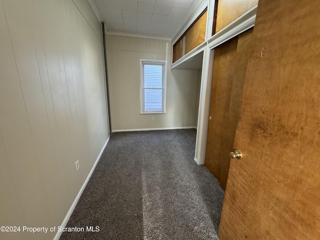 spacious closet featuring dark colored carpet