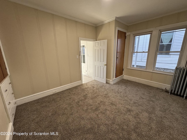 unfurnished bedroom with carpet floors and ornamental molding