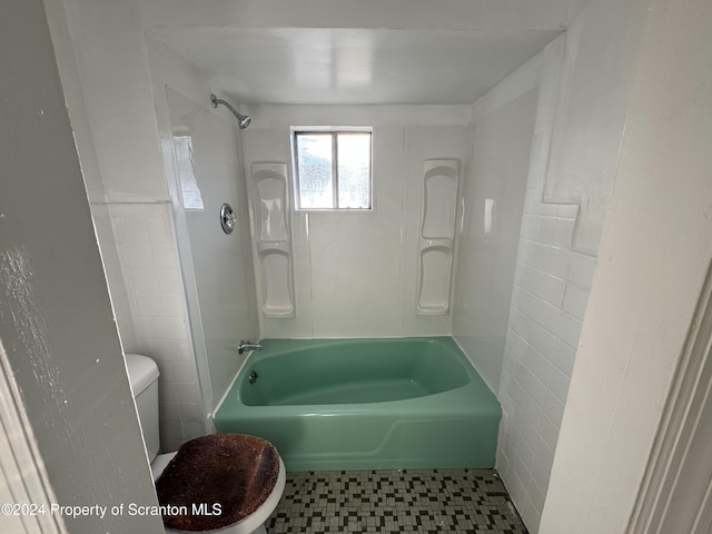 bathroom featuring toilet and shower / bathtub combination