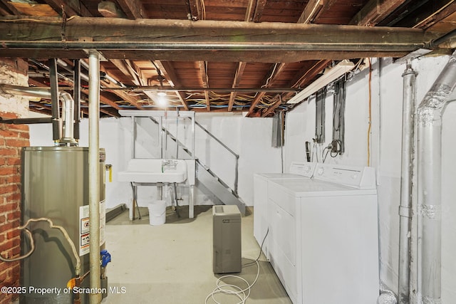 50 Harlem Ave, Carbondale, PA 18407 - unfinished basement with gas water heater, washing machine and clothes dryer, stairs, and a sink