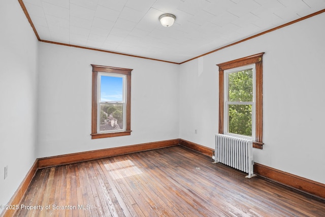 50 Harlem Ave, Carbondale, PA 18407 - spare room with radiator, crown molding, healthy amount of natural light, hardwood / wood-style floors, and baseboards