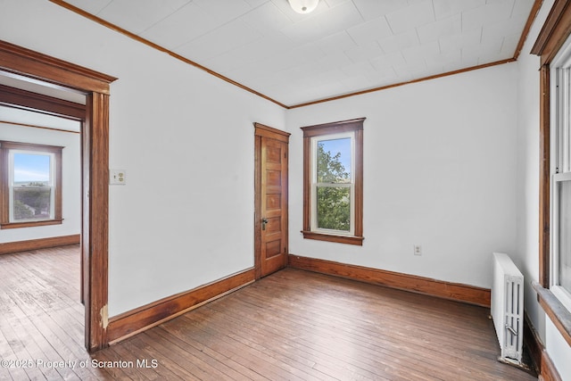 50 Harlem Ave, Carbondale, PA 18407 - spare room featuring ornamental molding, radiator, hardwood / wood-style floors, and baseboards