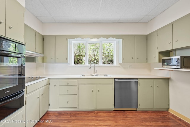 50 Harlem Ave, Carbondale, PA 18407 - kitchen featuring a sink, black appliances, a warming drawer, wood finished floors, and a drop ceiling