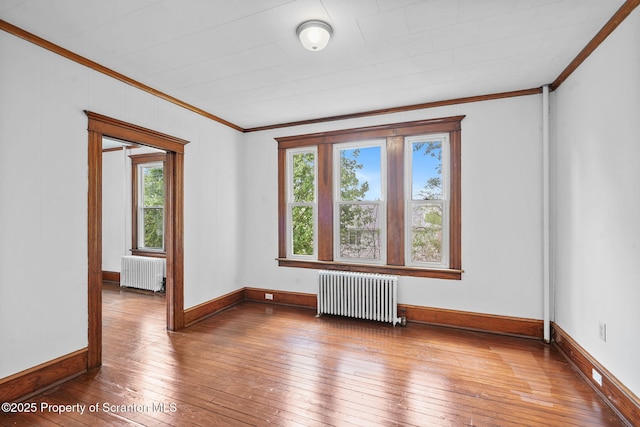 50 Harlem Ave, Carbondale, PA 18407 - unfurnished room featuring radiator, crown molding, hardwood / wood-style flooring, and baseboards