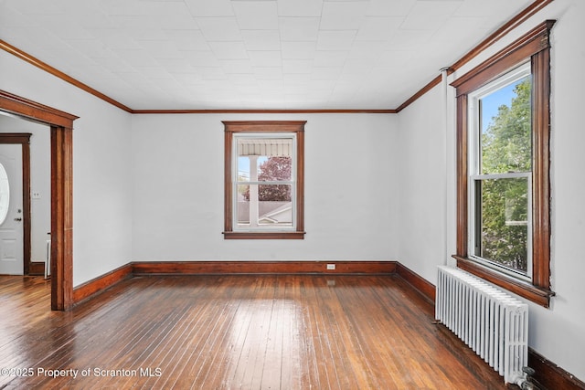 50 Harlem Ave, Carbondale, PA 18407 - unfurnished room featuring radiator heating unit, wood-type flooring, plenty of natural light, and ornamental molding