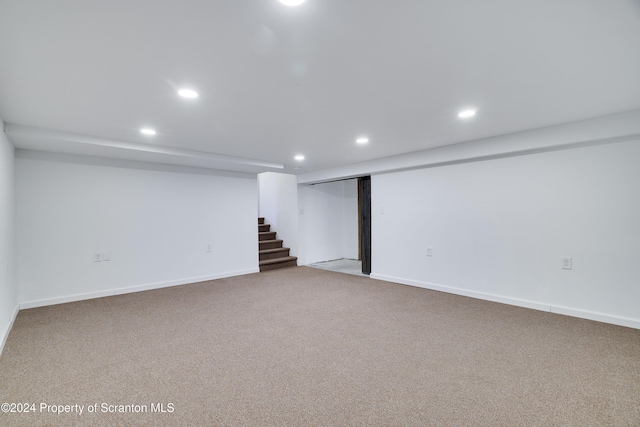 basement featuring carpet flooring