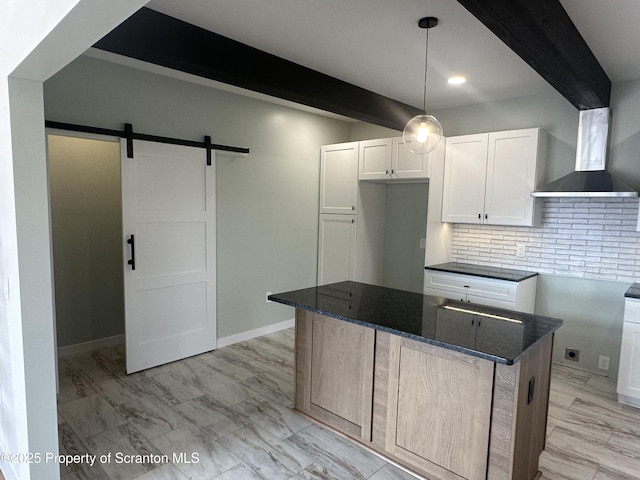 13692 State Route 374, Union Dale, PA 18470 - kitchen with beamed ceiling, white cabinetry, a barn door, dark stone countertops, and decorative backsplash