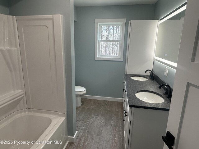 13692 State Route 374, Union Dale, PA 18470 - bathroom with a sink, baseboards, double vanity, and toilet