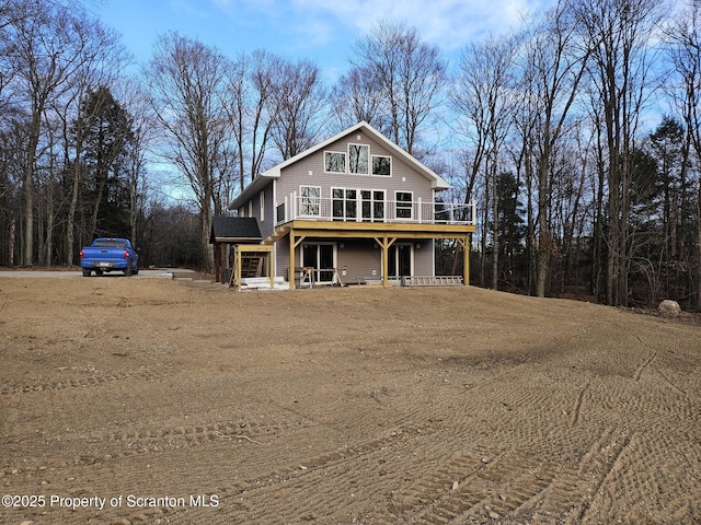 view of front of property featuring a wooden deck