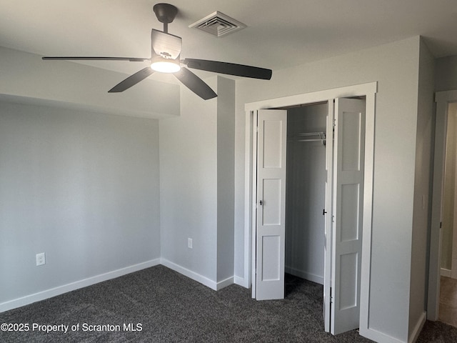 13692 State Route 374, Union Dale, PA 18470 - unfurnished bedroom featuring a closet, baseboards, a ceiling fan, visible vents, and dark carpet