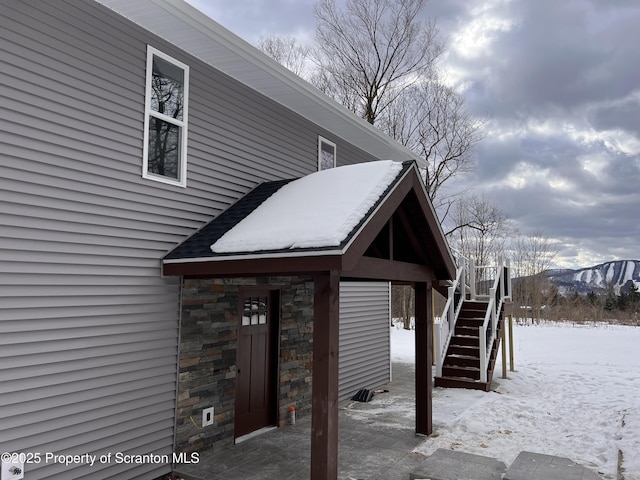 13692 State Route 374, Union Dale, PA 18470 - snow covered property featuring stone siding and stairs