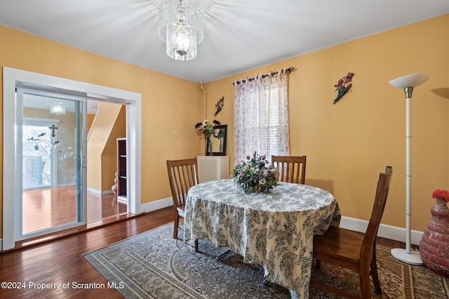 dining room with dark hardwood / wood-style flooring