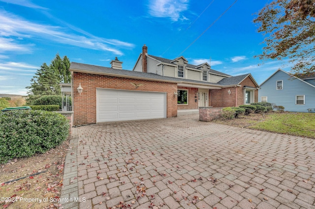 view of front of property featuring a garage