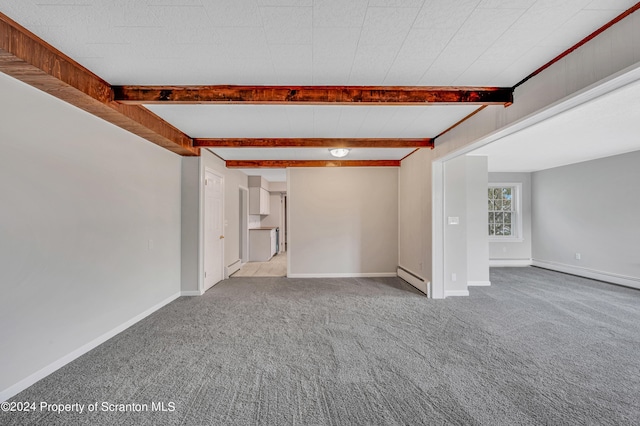 unfurnished living room with beamed ceiling, baseboard heating, and light carpet