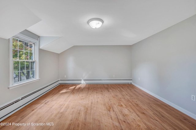 bonus room featuring lofted ceiling and light hardwood / wood-style flooring