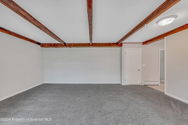 spare room with beam ceiling, light colored carpet, and a baseboard heating unit