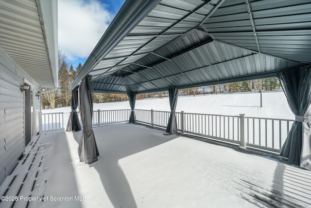 snow covered patio with a gazebo