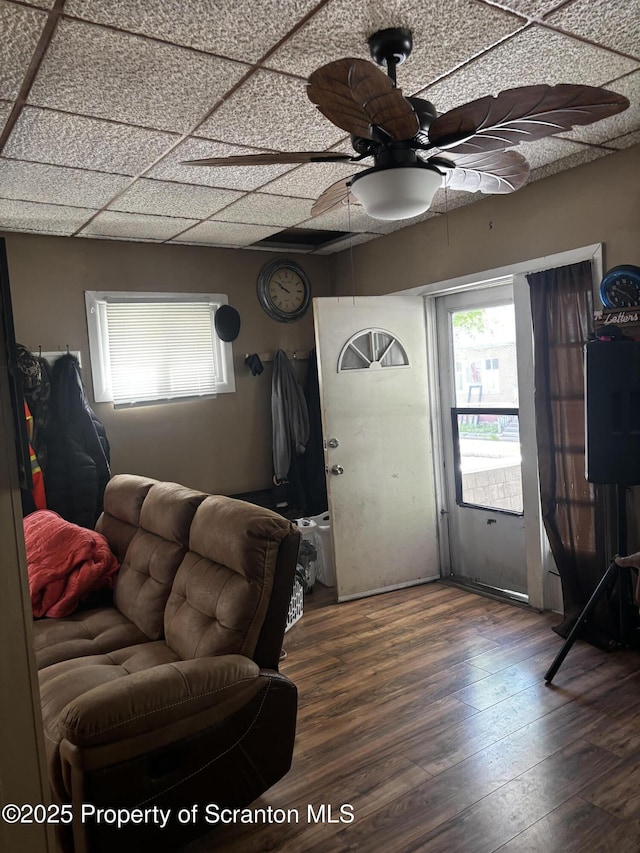 living area featuring ceiling fan and wood finished floors