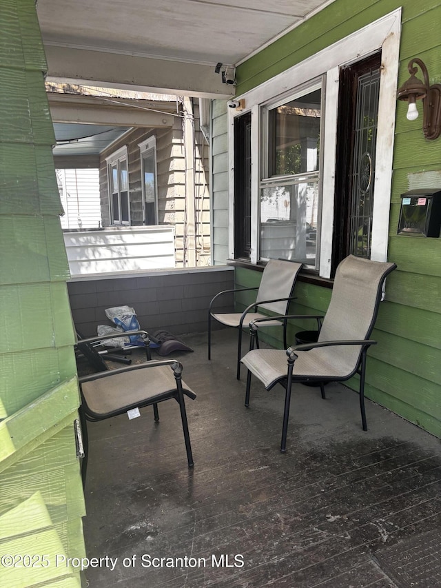 view of patio featuring a porch