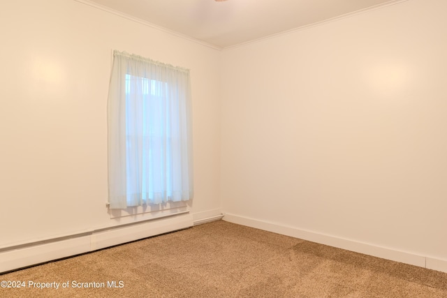 carpeted spare room with ornamental molding and baseboard heating