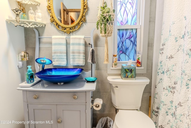 bathroom featuring vanity and toilet